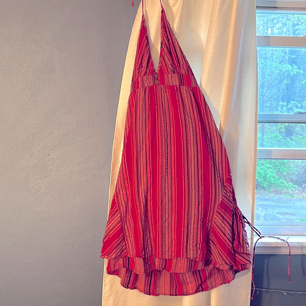 Sundress in red variations. Perfect condition, has pockets. Halter string tie.
